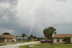 A lightning strike during a daytime thunderstorm